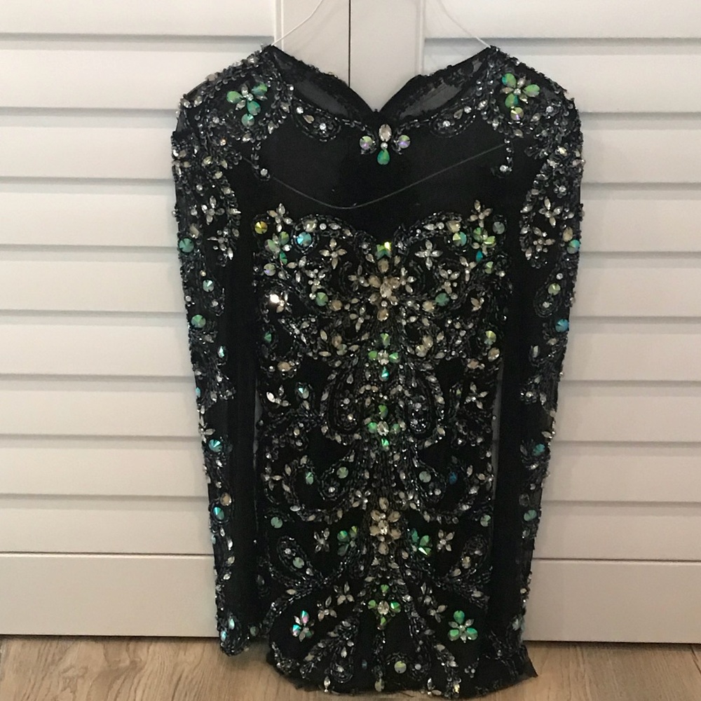 Embellished black mini dress.